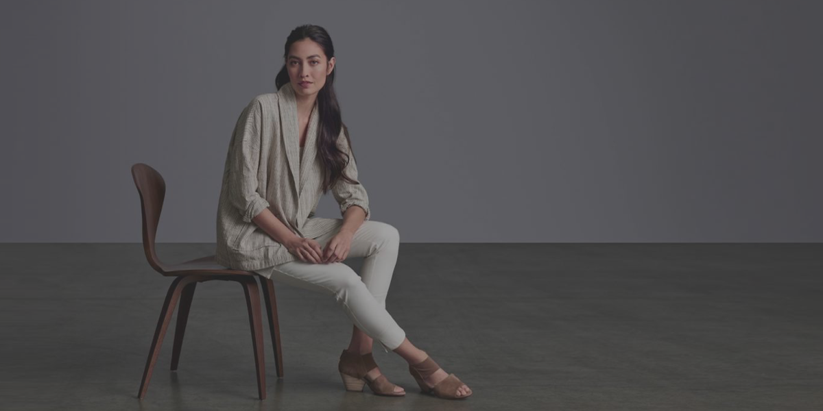 An image used by Eileen Fisher for their digital signs with a brunette woman